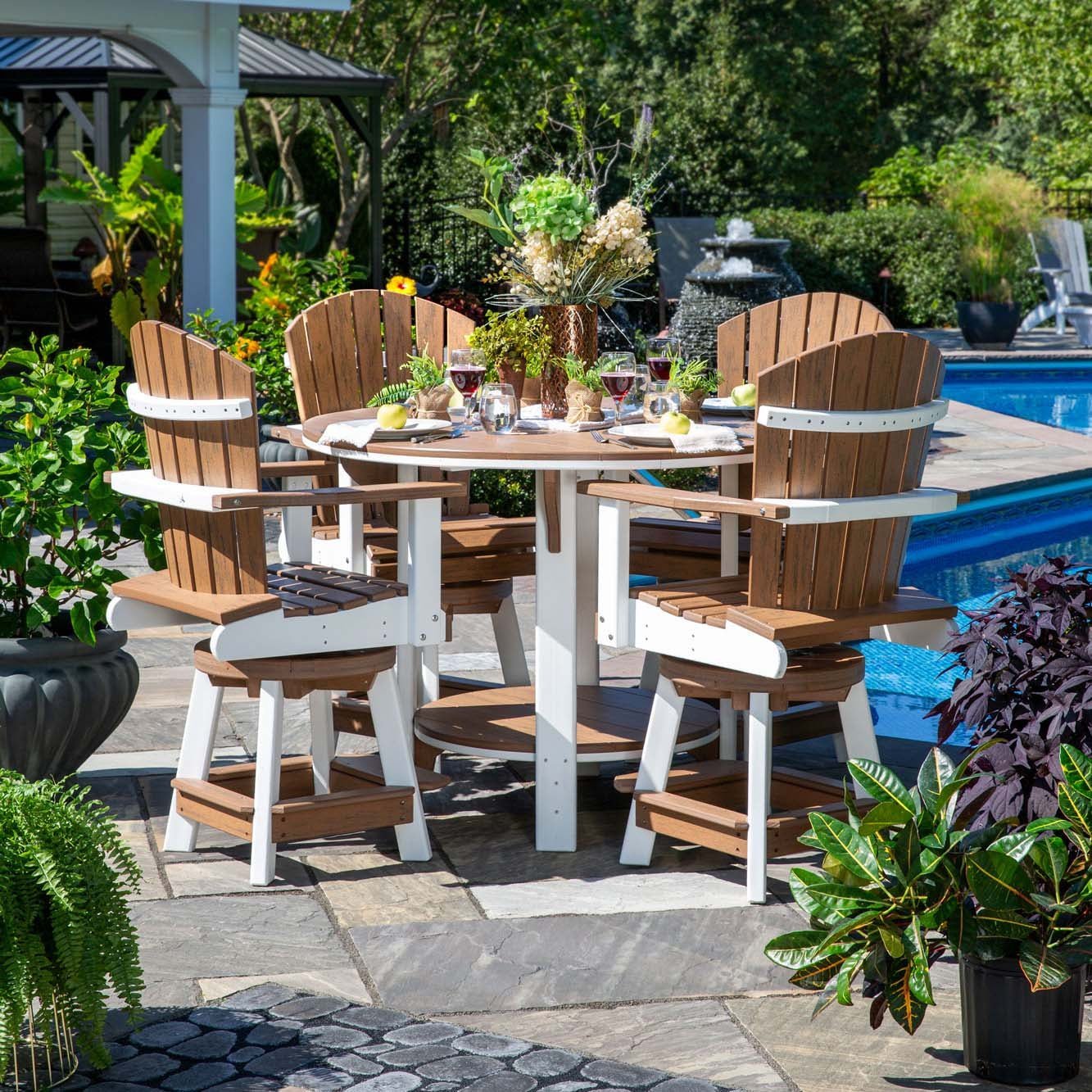 Nutmeg and white poly counter height table with four swivel Adirondack bar chairs set with wine poolside