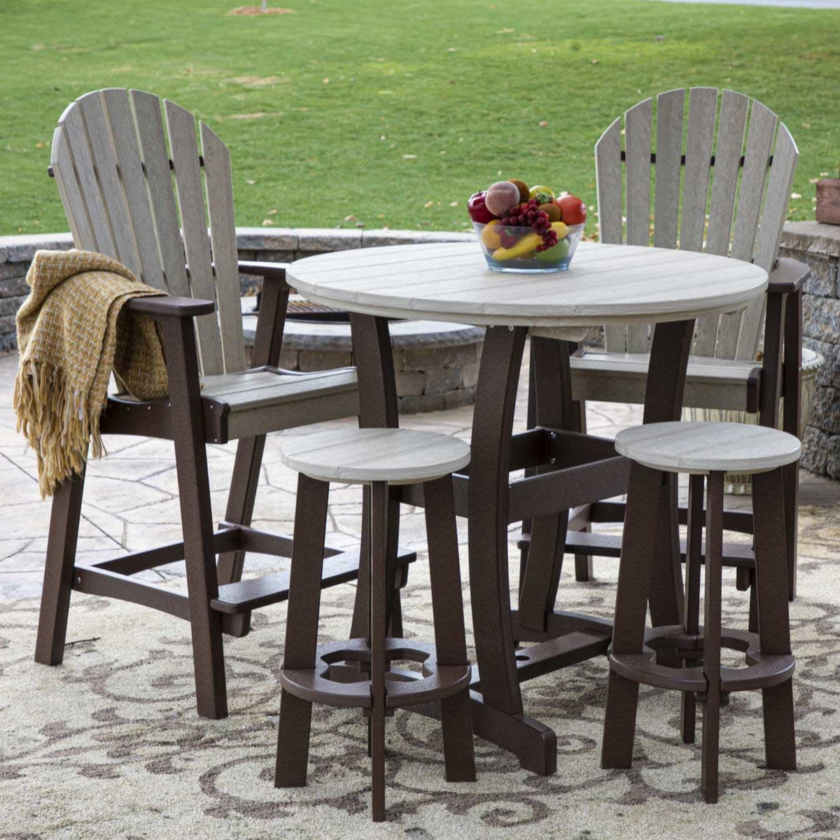 Bar height poly patio set with a round gray top, brown base, two tall fan-back chairs and two round bar stools