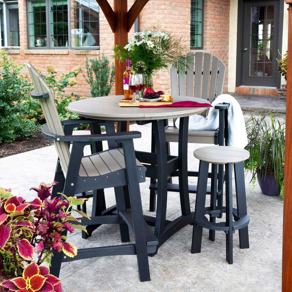 Bar height poly patio set with a round gray top, brown base, two tall fan-back chairs and two round bar stools