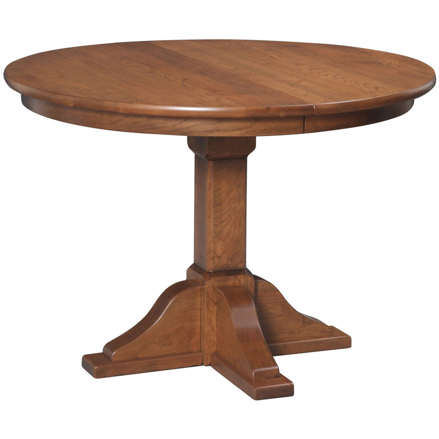 Round single pedestal expandable dining table in a warm cherry finish with a paneled column and flared base