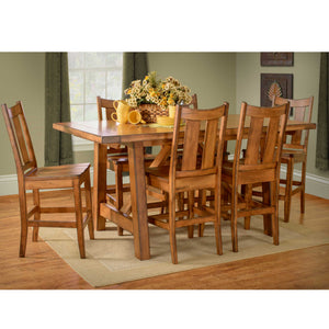 Aspen counter height trestle table in warm oak with six matching stools set with yellow flowers and mugs
