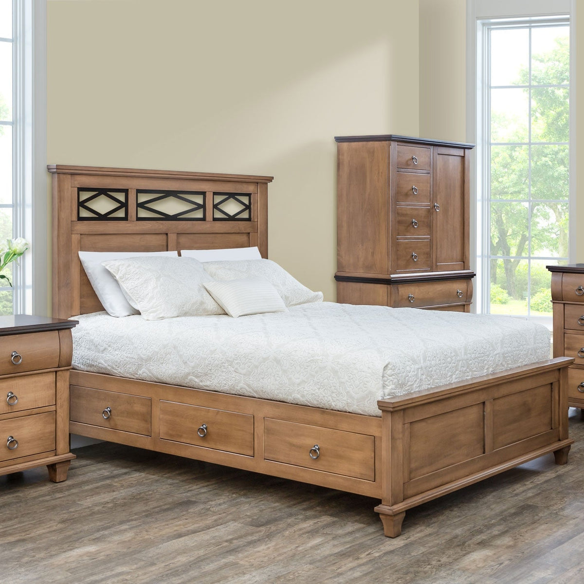 Bedroom scene with a lattice headboard storage bed, tall door and drawer armoire and nightstand in light almond