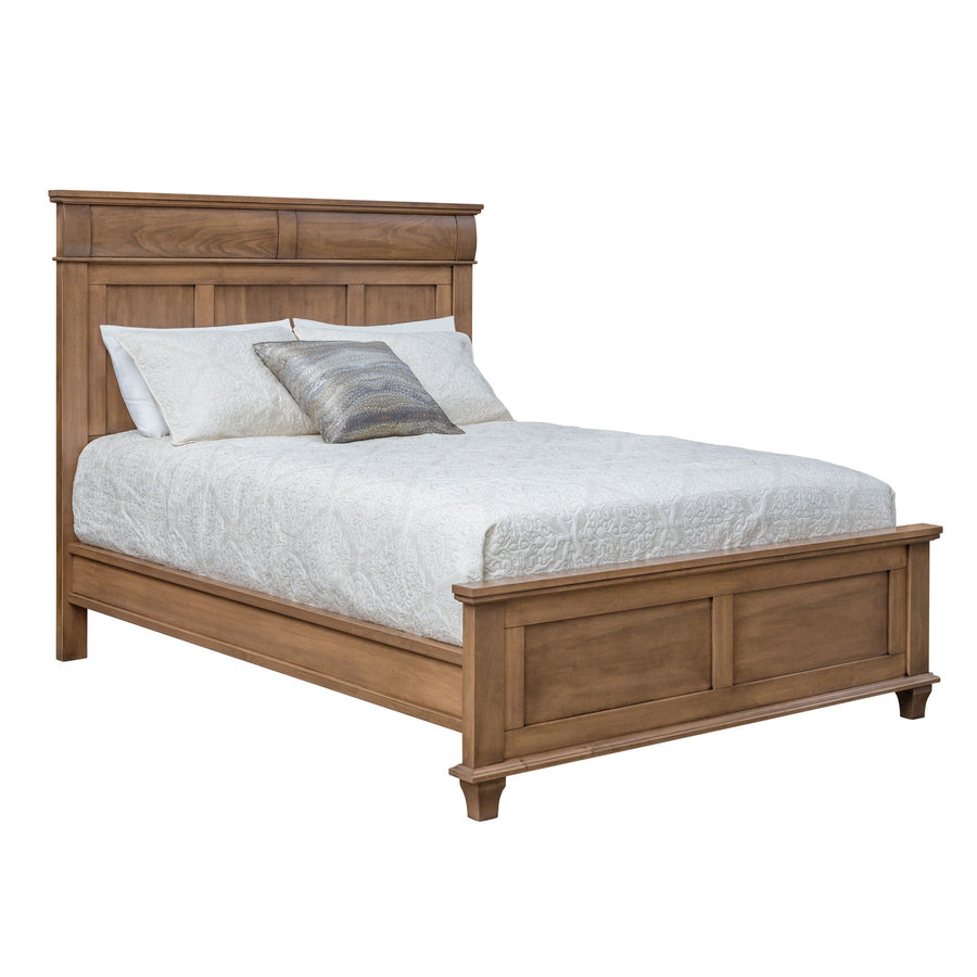 Solid wood panel bed in light almond with a paneled headboard, low panel footboard and tapered feet on white