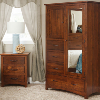 Cherry chiffonier with a mirrored door, upper panel door, four drawers and a wide bottom drawer beside a nightstand