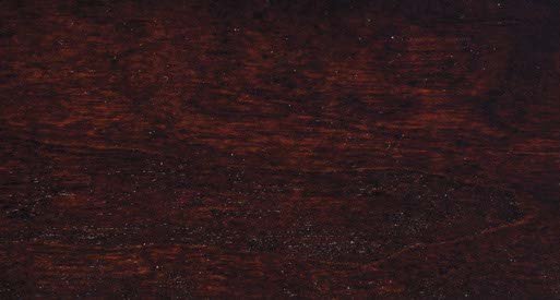 Bing Cherry stain swatch on cherry wood, a very dark red brown finish with tight straight grain and glossy sheen