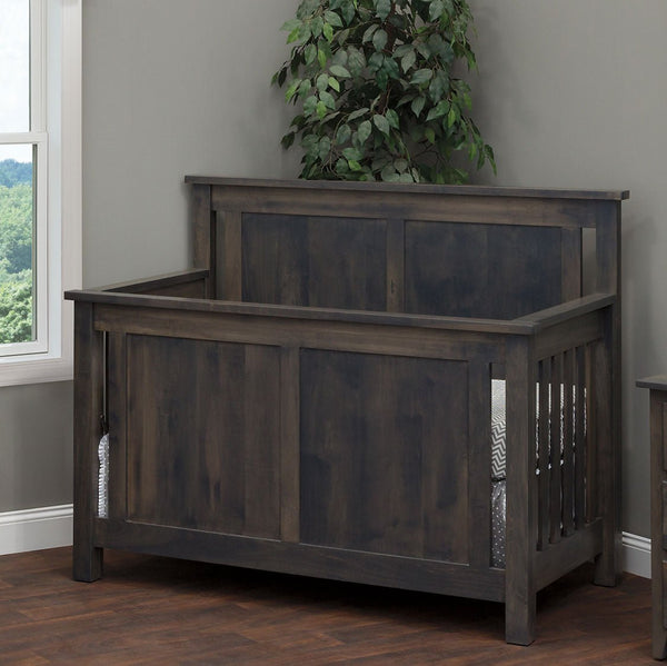Weathered gray Bloomington crib with flat raised panel ends and slatted sides in a bright corner nursery