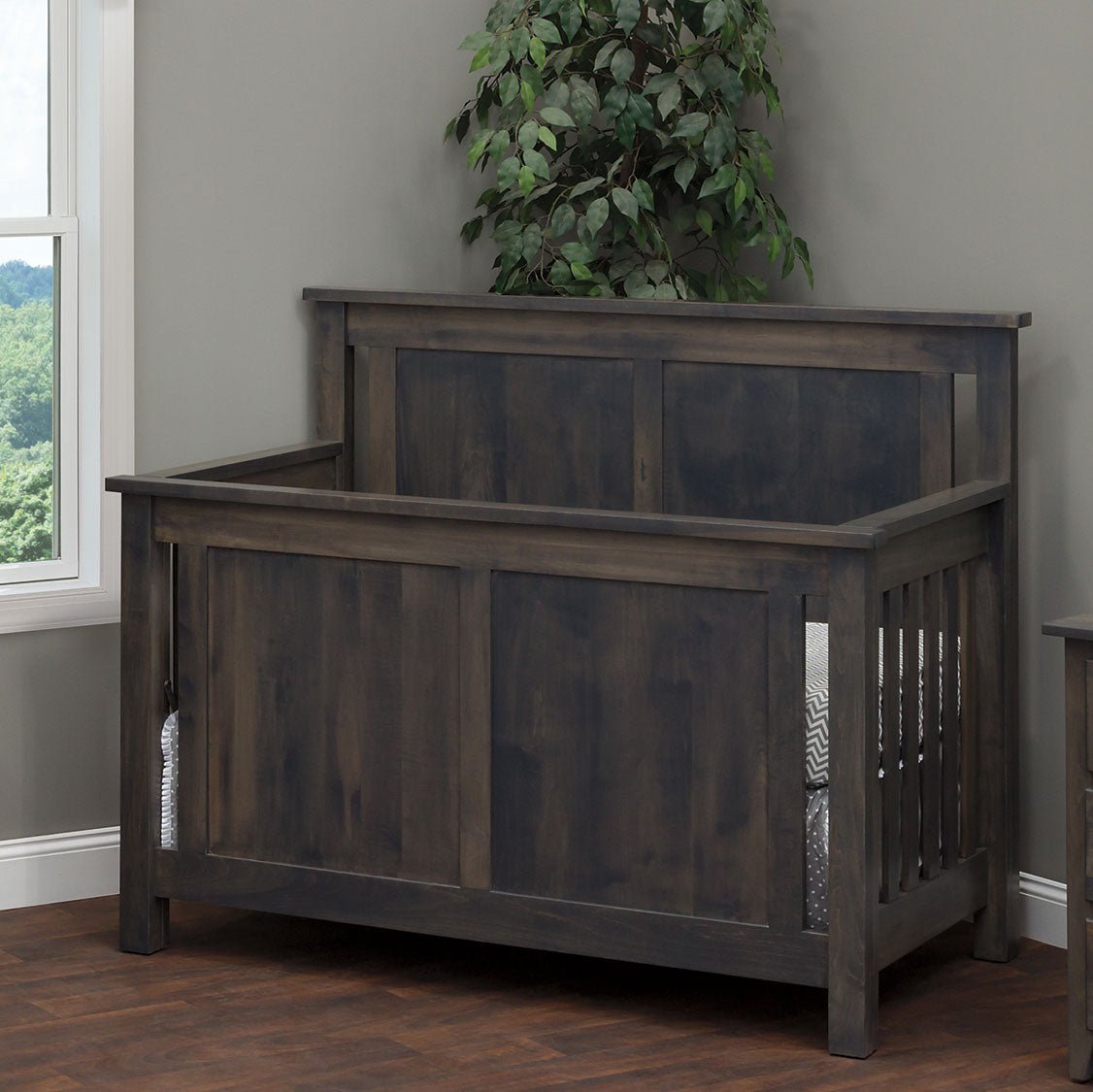 Weathered gray Bloomington crib with flat raised panel ends and slatted sides in a bright corner nursery