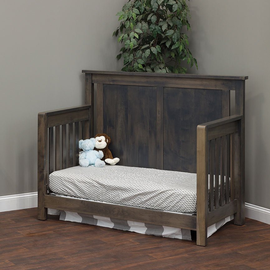 Bloomington crib in day bed configuration with open front, gray panel headboard and chevron print mattress