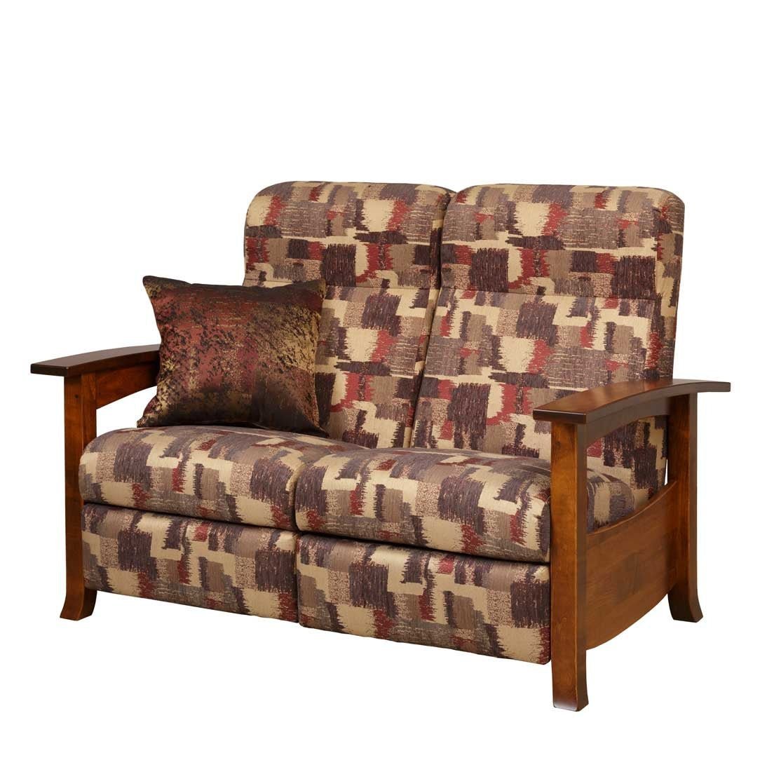 Reclining loveseat in geometric patterned fabric next to a raised lift top coffee table in a sunlit room