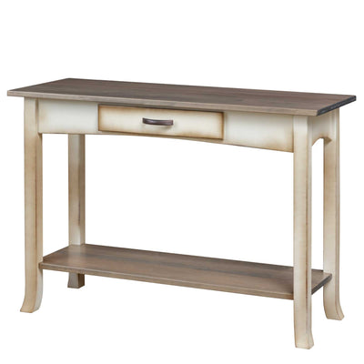 Coastal console table with gray plank top, cream painted apron, single drawer and lower shelf on white