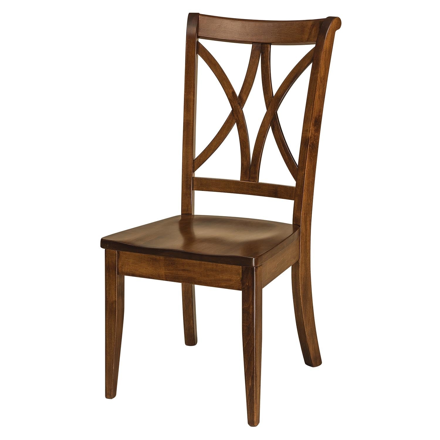 X back dining side chairs in weathered oak with cream upholstered seats around a round pedestal table by a stone fireplace