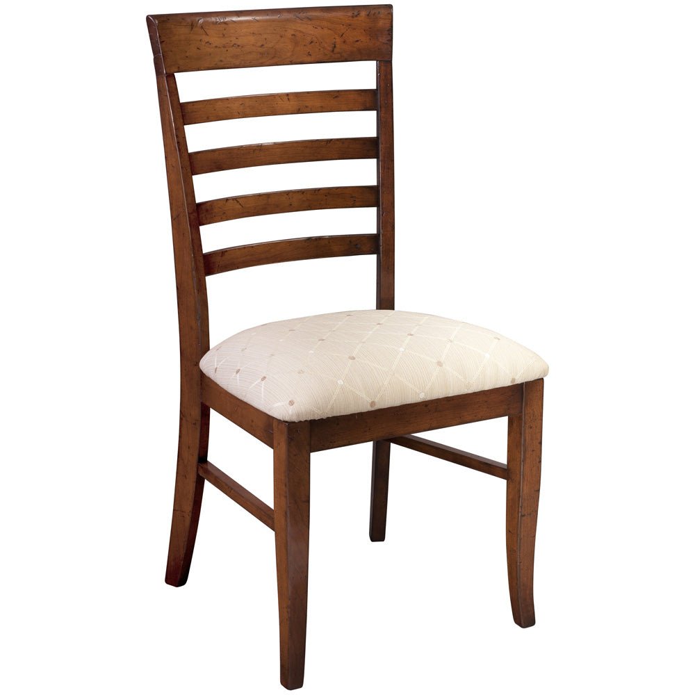 Modern ladder back side chair in a distressed cherry finish with a cream diamond patterned fabric seat