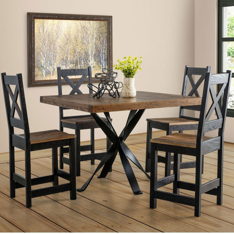 Square reclaimed top table with black iron base and four black X back counter chairs with stained seats