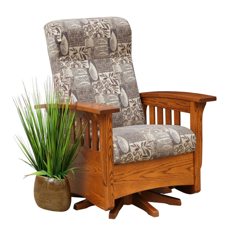Oak swivel glider chair with patterned leaf print upholstery, slat sides and a pedestal swivel base