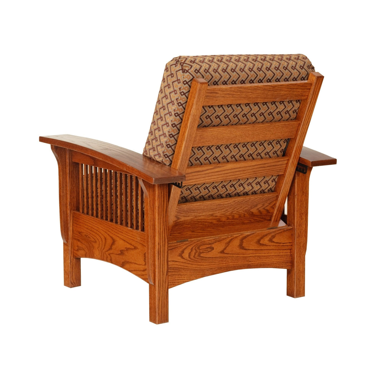 Rear angle of an oak Morris chair showing the paneled back, spindle sides and patterned adjustable cushion