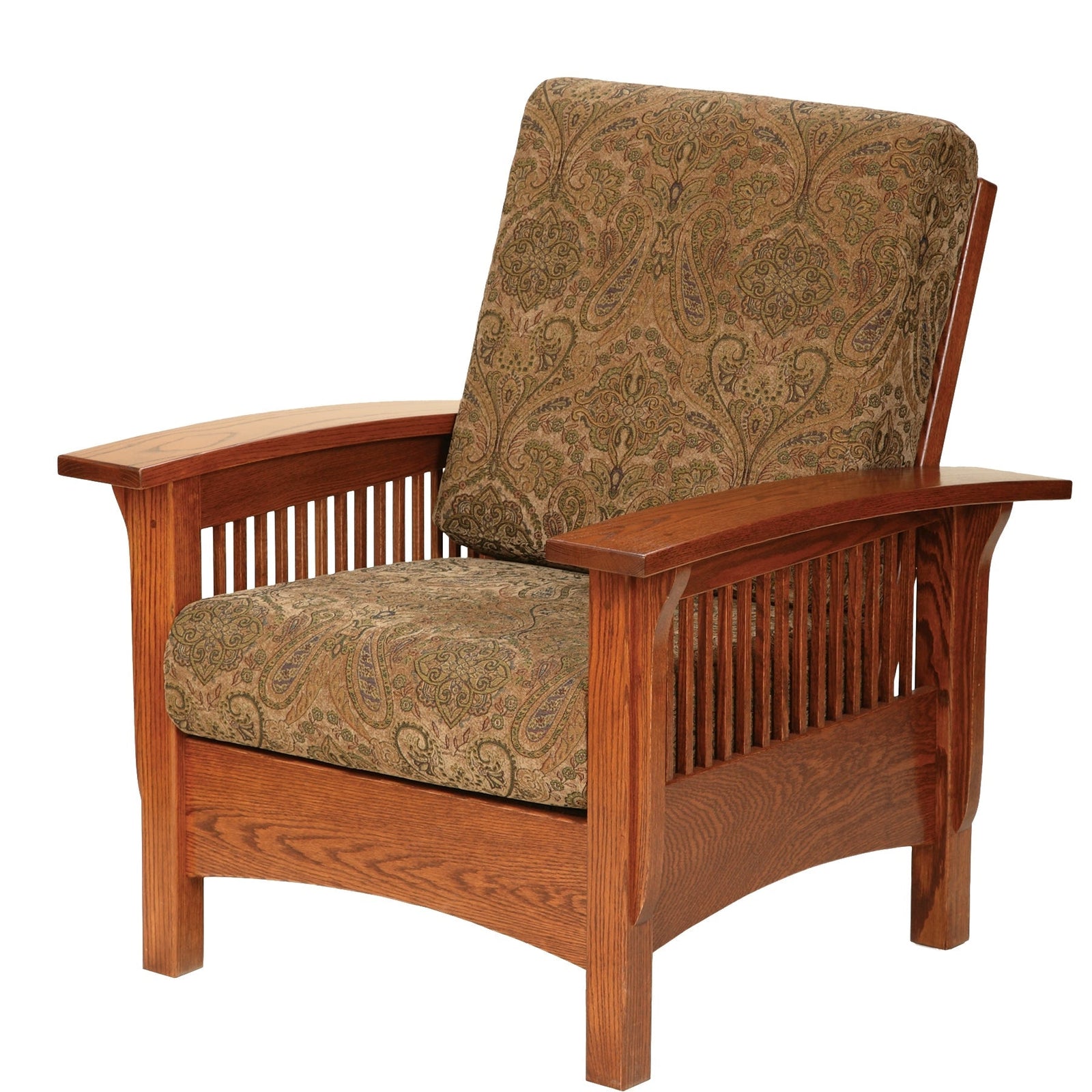 Oak mission Morris chair with oatmeal cushions and a throw, beside a slatted end table and lamp by a window
