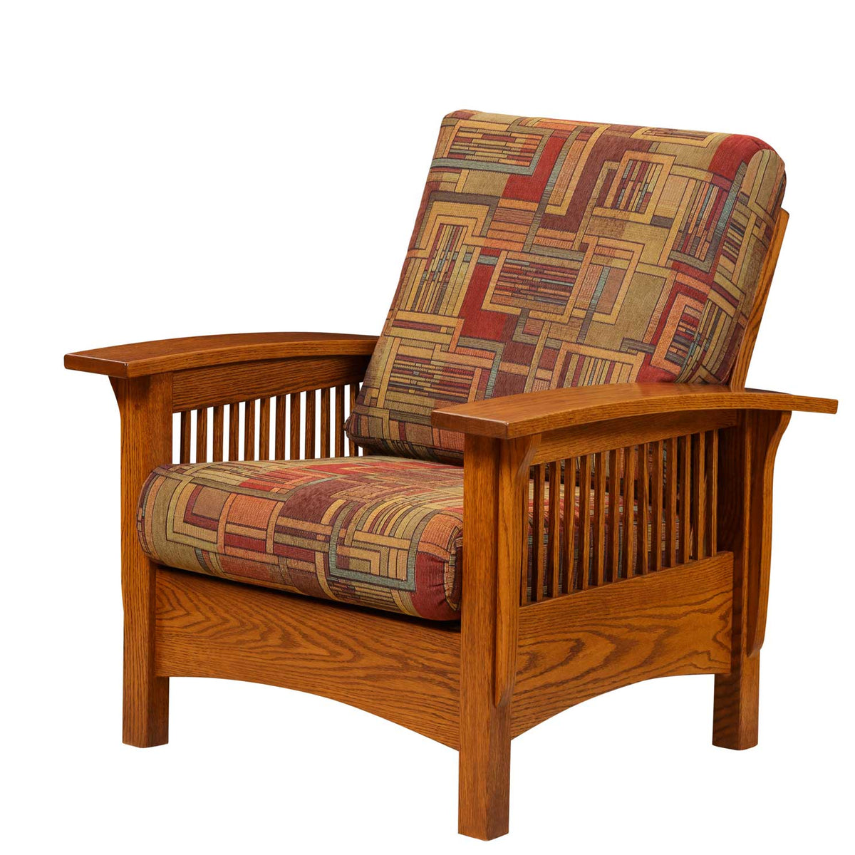 Angled Morris chair with red and gold geometric cushions, oak spindle sides and arched skirt on white