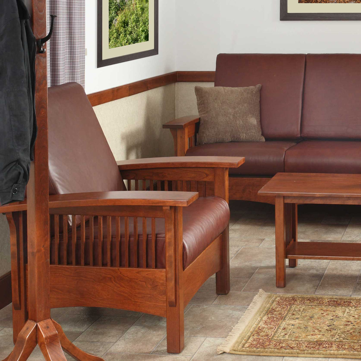 Cherry mission chair and matching leather sofa with spindle sides in a room with a coat rack and rug