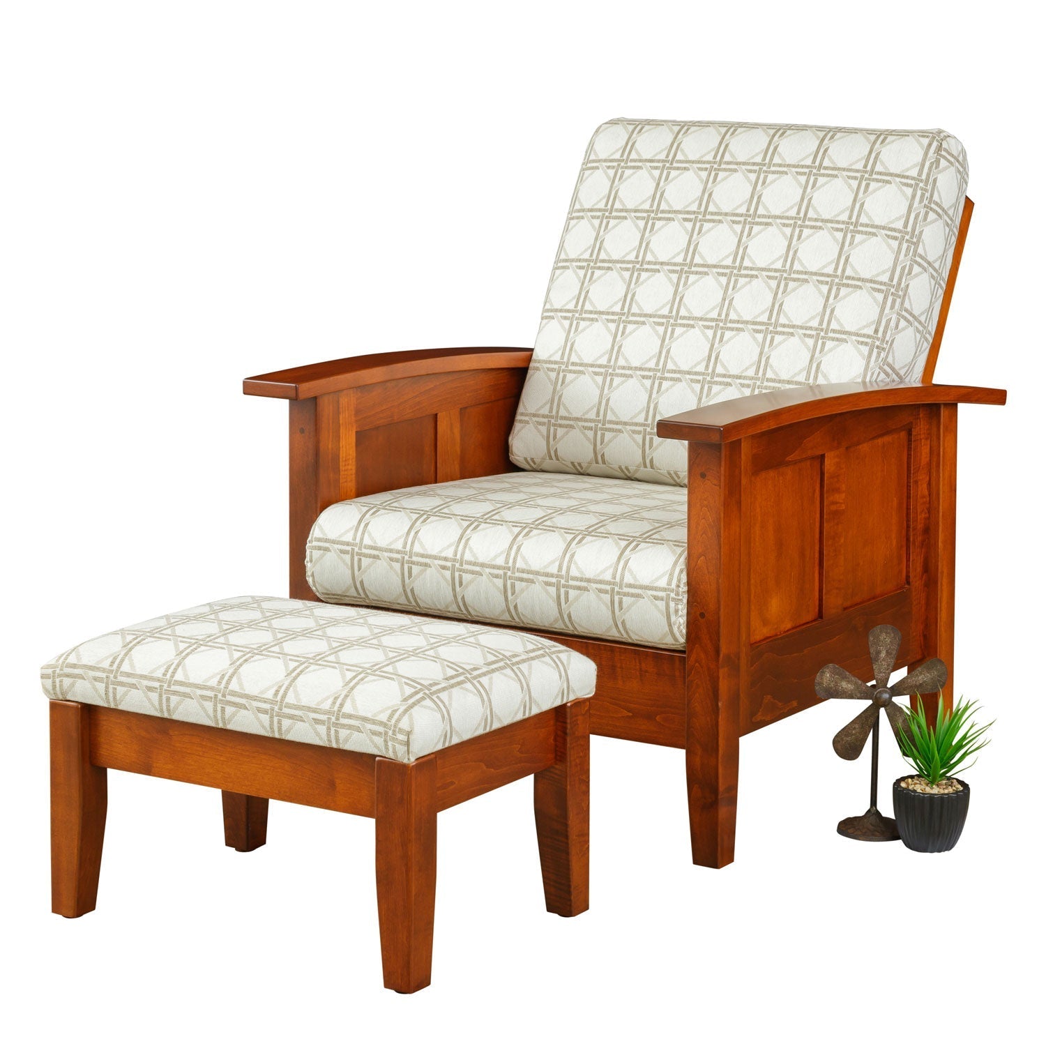 Shaker Morris chair in dark cherry with paneled sides, patterned circle upholstery and matching footstool by a fireplace