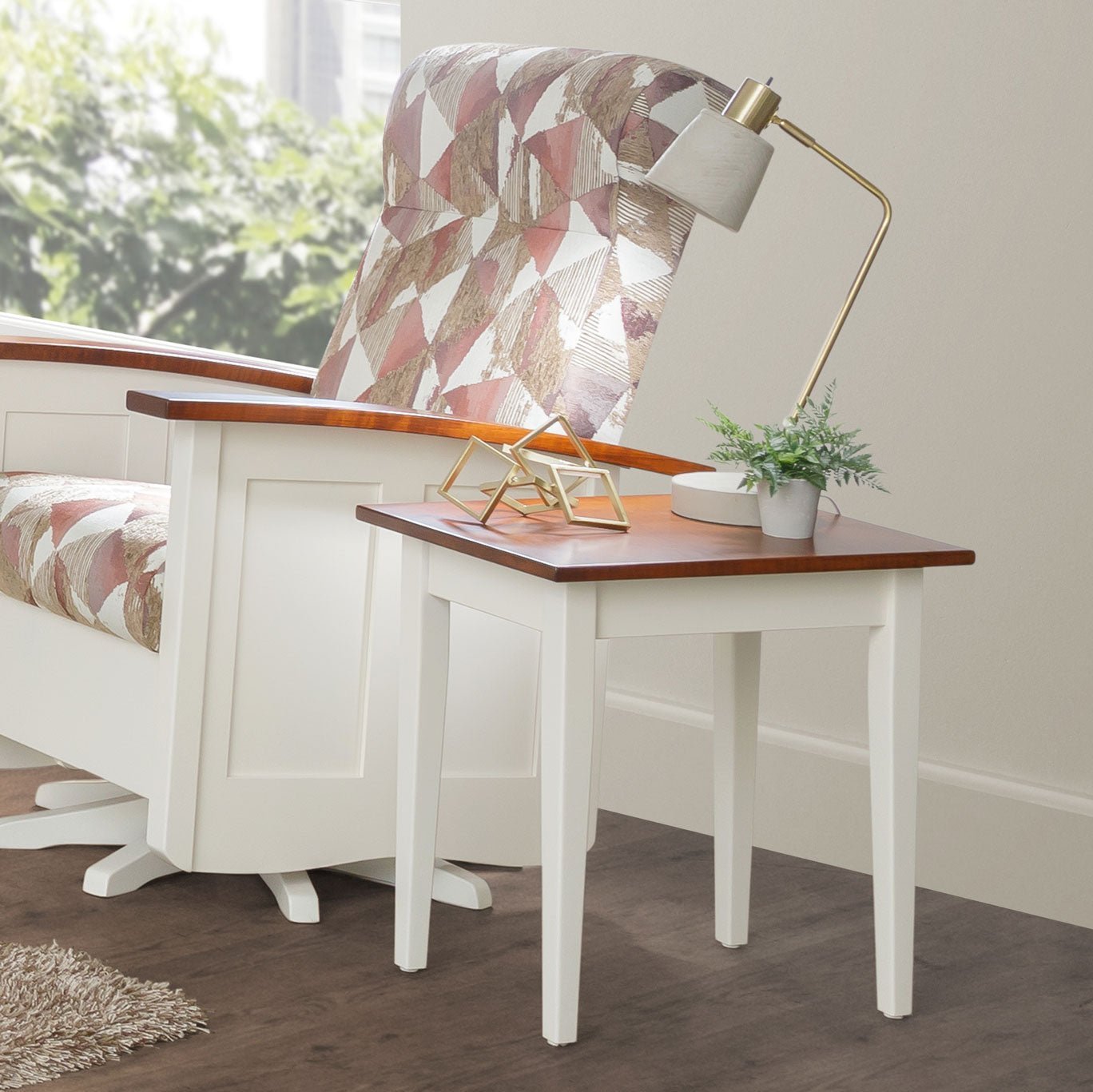 White painted Shaker petite end table with a cherry-stained top, square legs and slim apron, styled with a brass lamp and plant