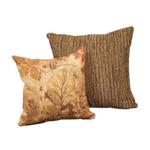 Pair of throw pillows in a gray and cream geometric lattice weave resting on a tan reclining sofa