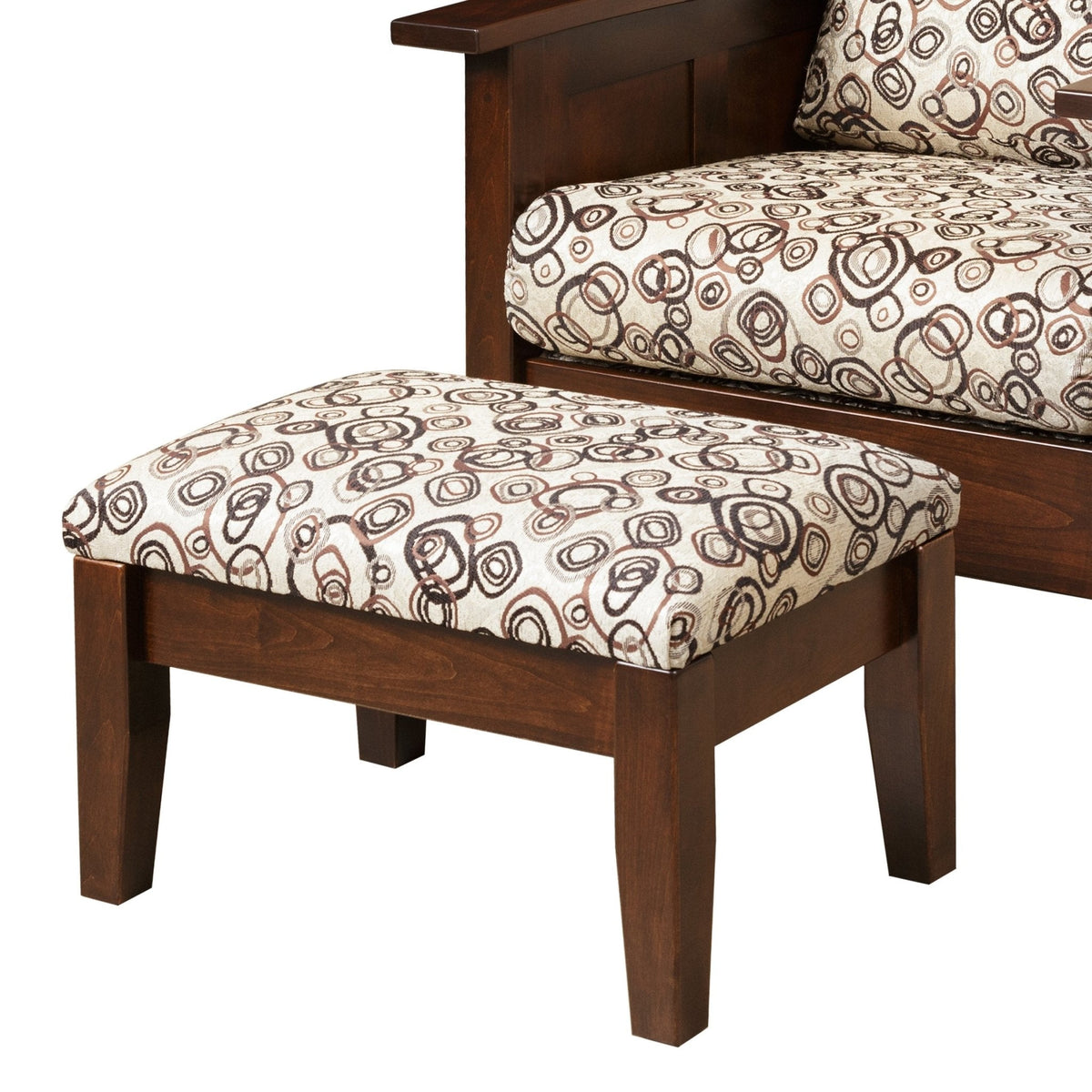 Close-up of a cherry wood frame ottoman with cream circle-print cushion top and square tapered legs