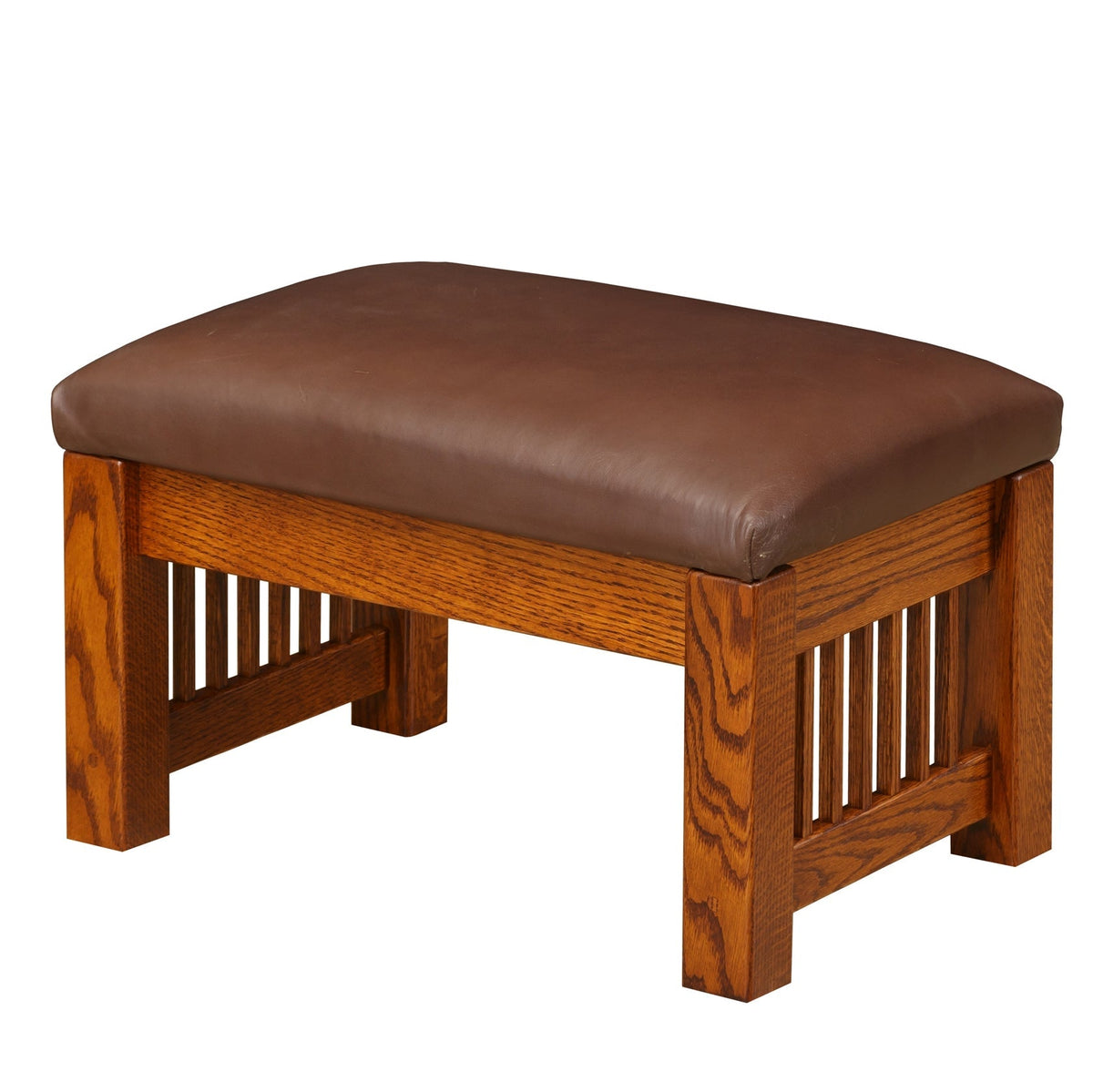 Mission oak ottoman with brown leather top and vertical slat side panels between thick square legs
