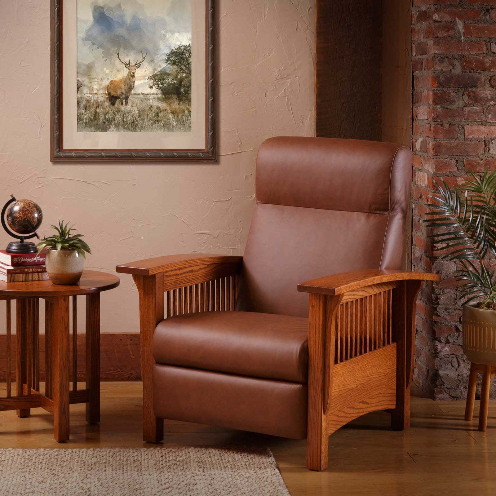 Oak Mission recliner in brown leather with slatted sides and wide flat arms in a room with brick wall and side table