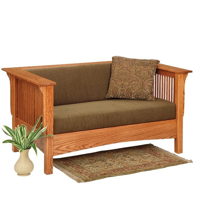 Oak Mission slat side loveseat with olive green cushions in a room with a matching coffee table and end table