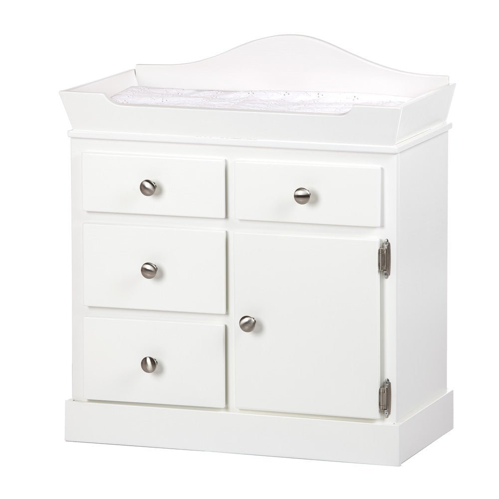White wooden doll changing table with an arched back rail, padded white pad, three drawers and a side cabinet door