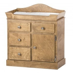 White wooden doll changing table with an arched back rail, padded white pad, three drawers and a side cabinet door