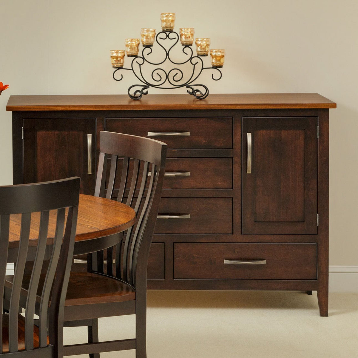 Two-tone dining sideboard with an oak top, espresso base, three center drawers, two doors and two wide drawers
