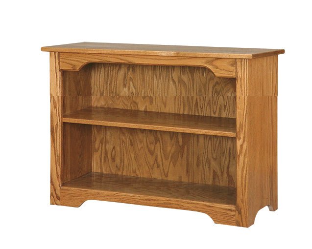 Golden oak 24 inch bookcase with one adjustable shelf, arched top rail and scalloped base