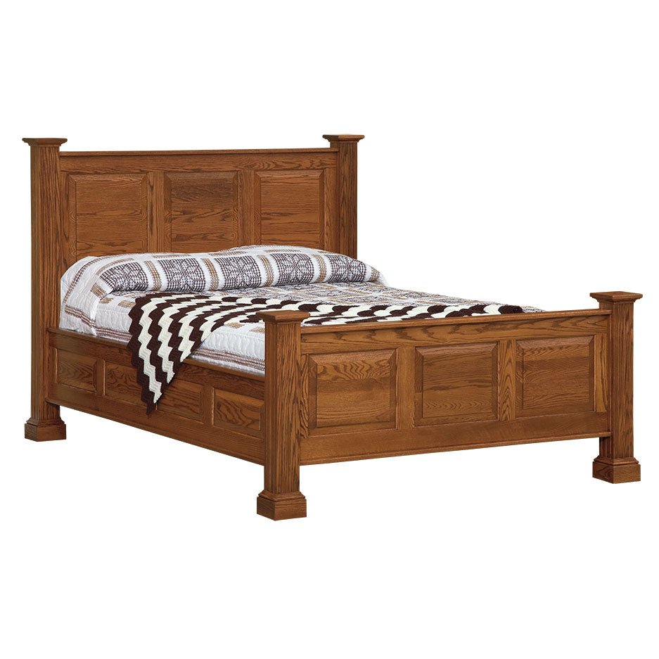 Oak deluxe raised panel bed with square capped posts, three-panel headboard and a black and white throw