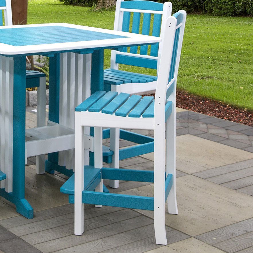 Aruba blue and white poly bar height side chair with slat back and footrest beside a square patio bar table