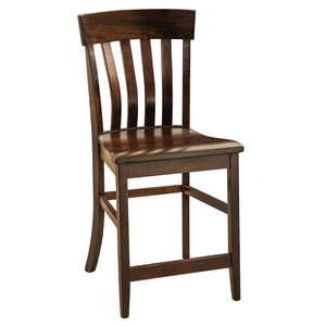 Dark brown counter stool with a curved crest rail, four shaped back slats, wood seat and stretcher footrests