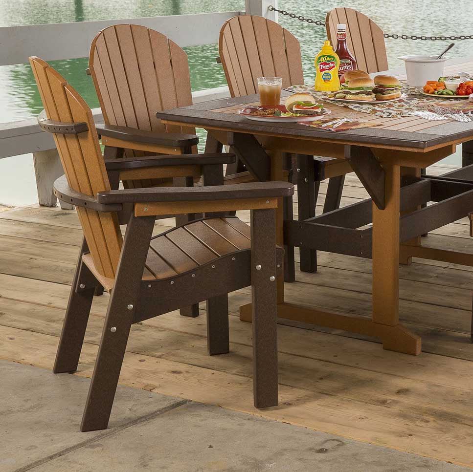 Cedar and brown poly Adirondack dining chairs with contoured slat seats around a patio table on a dock