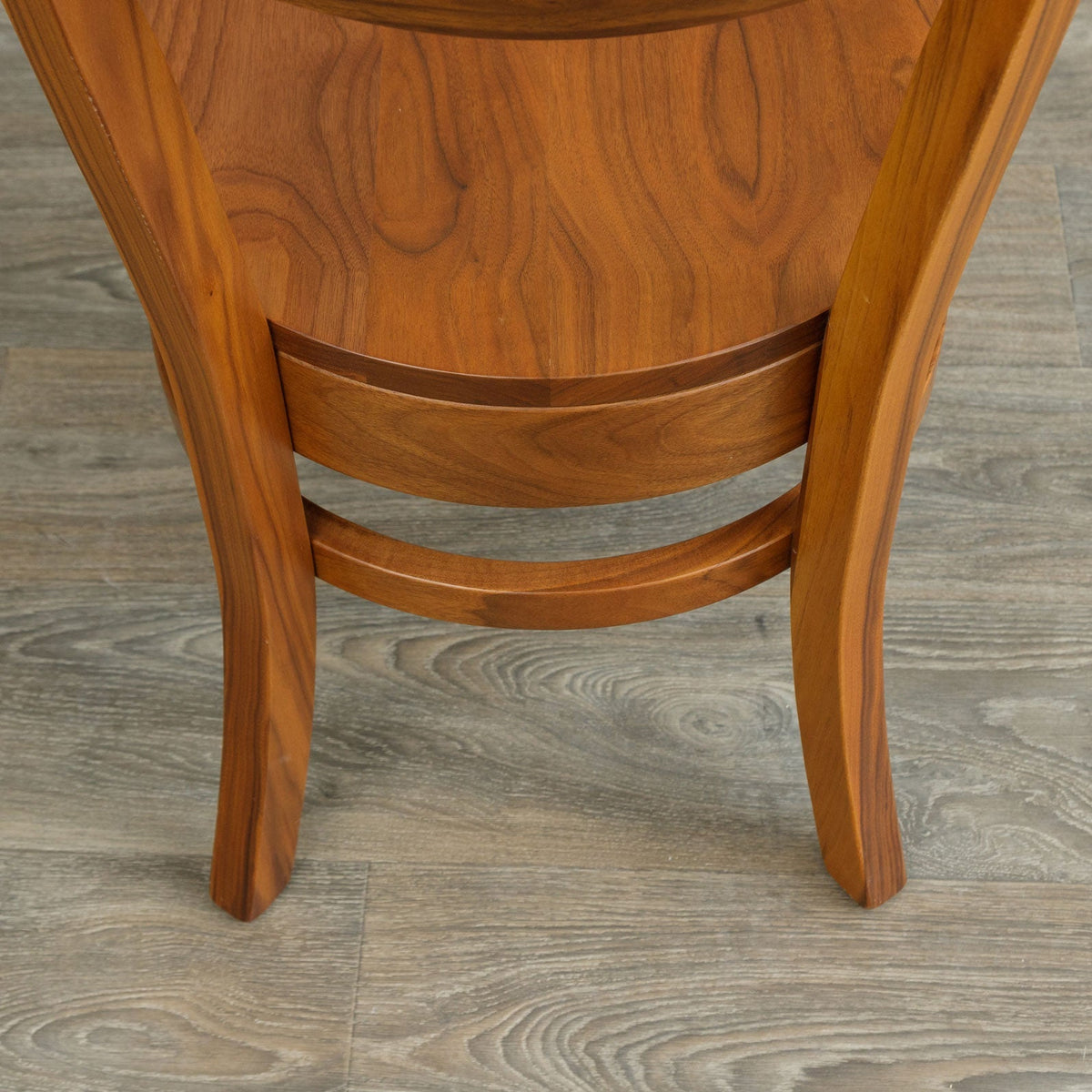 Rear view of the walnut mid century dining chair showing the curved back supports and two shaped rail stretchers
