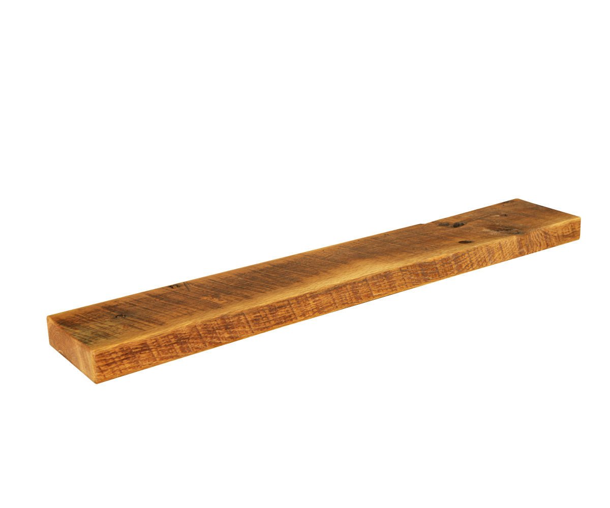 Reclaimed barnwood floating shelf about three feet long with saw marks and a clear honey finish