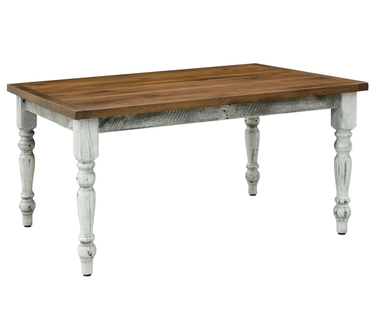 Reclaimed wood farm dining table with a warm stained top and chunky distressed white turned legs