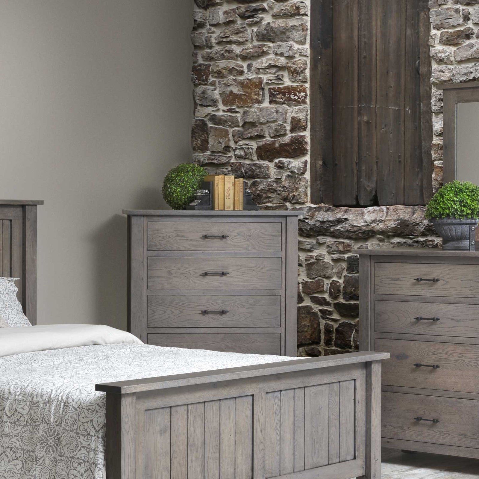 Weathered gray oak chest of drawers with five graduated drawers, black bar pulls and heavy square corner posts