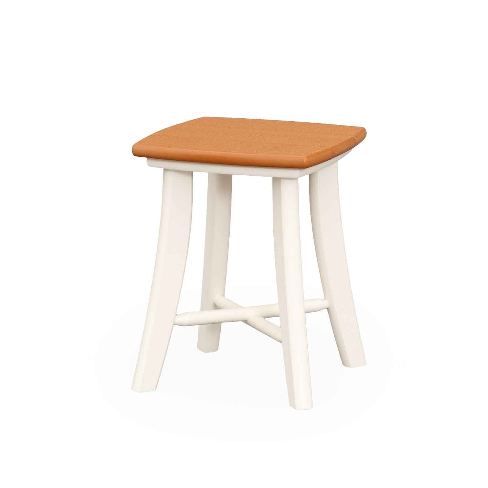White poly patio side table with a gray top and splayed legs holding a lantern beside a white rocker