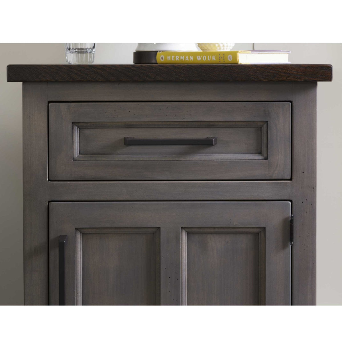 Front detail of the gray nightstand drawer and two-panel door showing the raised molding and distressed rub-through finish