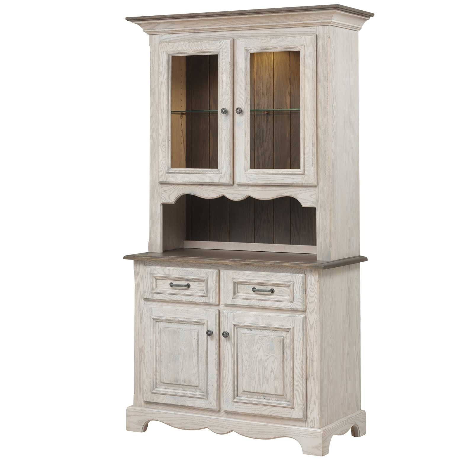 Whitewashed china cabinet with lighted glass doors displaying dishes above a two door buffet base