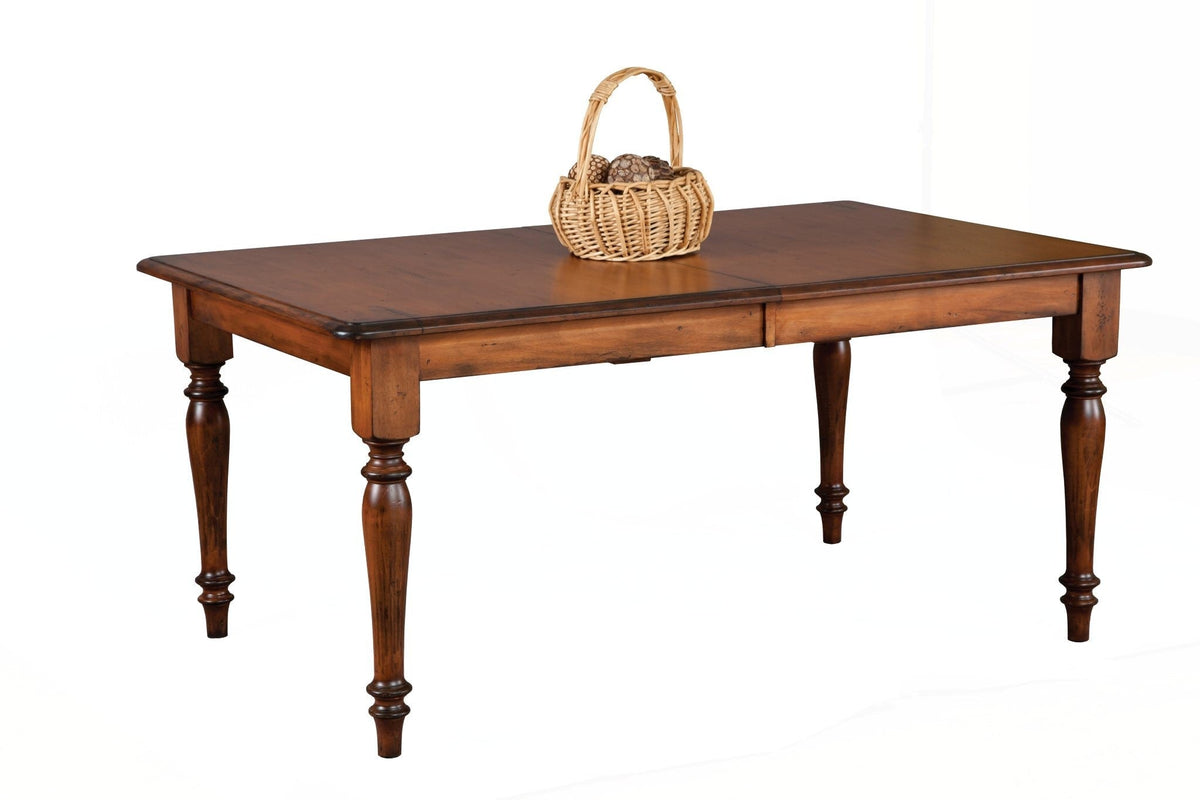 Amish solid wood turned-leg dining table in a rich two-tone cherry finish with darker burnished edges
