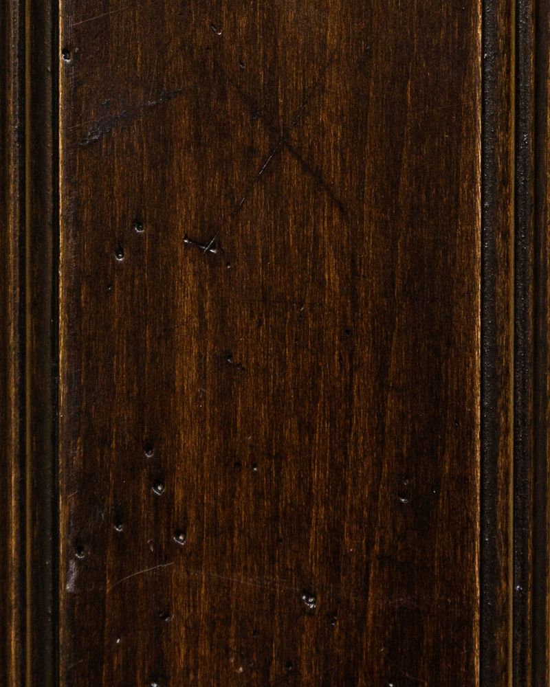 Java Renaissance stain on maple showing a dark espresso brown panel with worm hole distressing