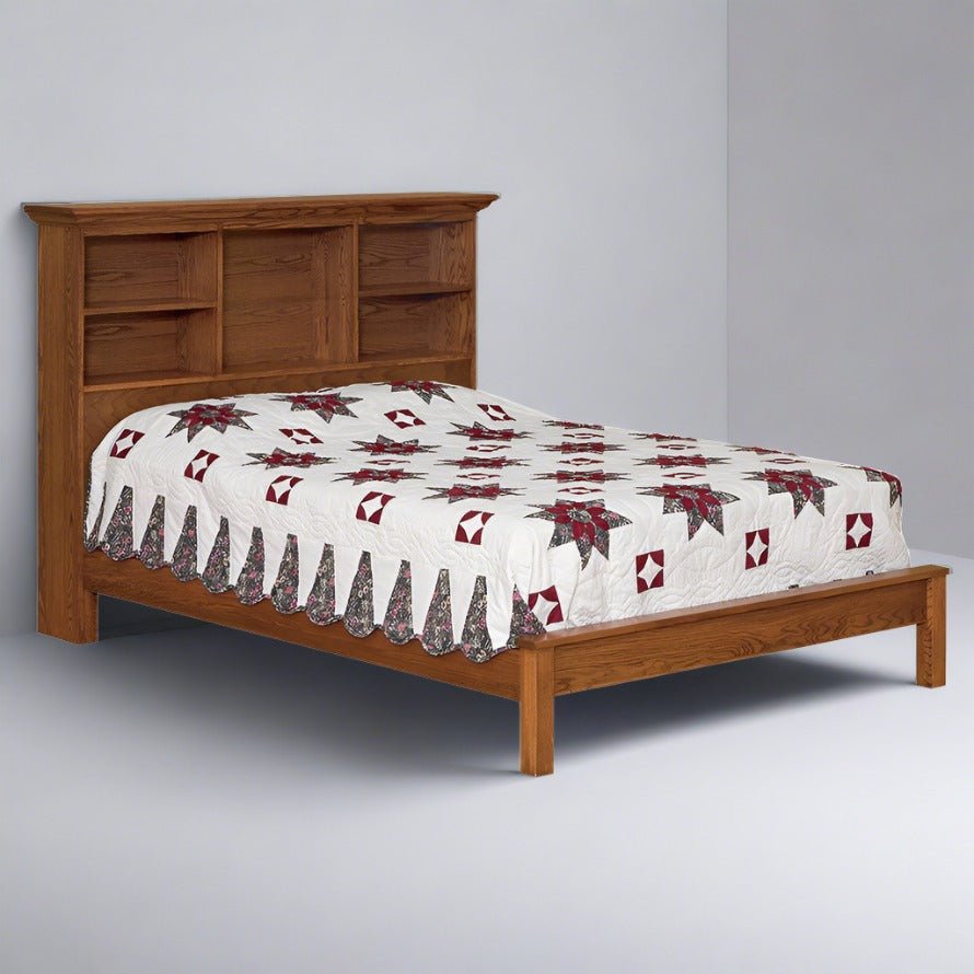 Oak bookcase headboard bed with three open shelf cubbies and a low plain footboard, star patchwork quilt