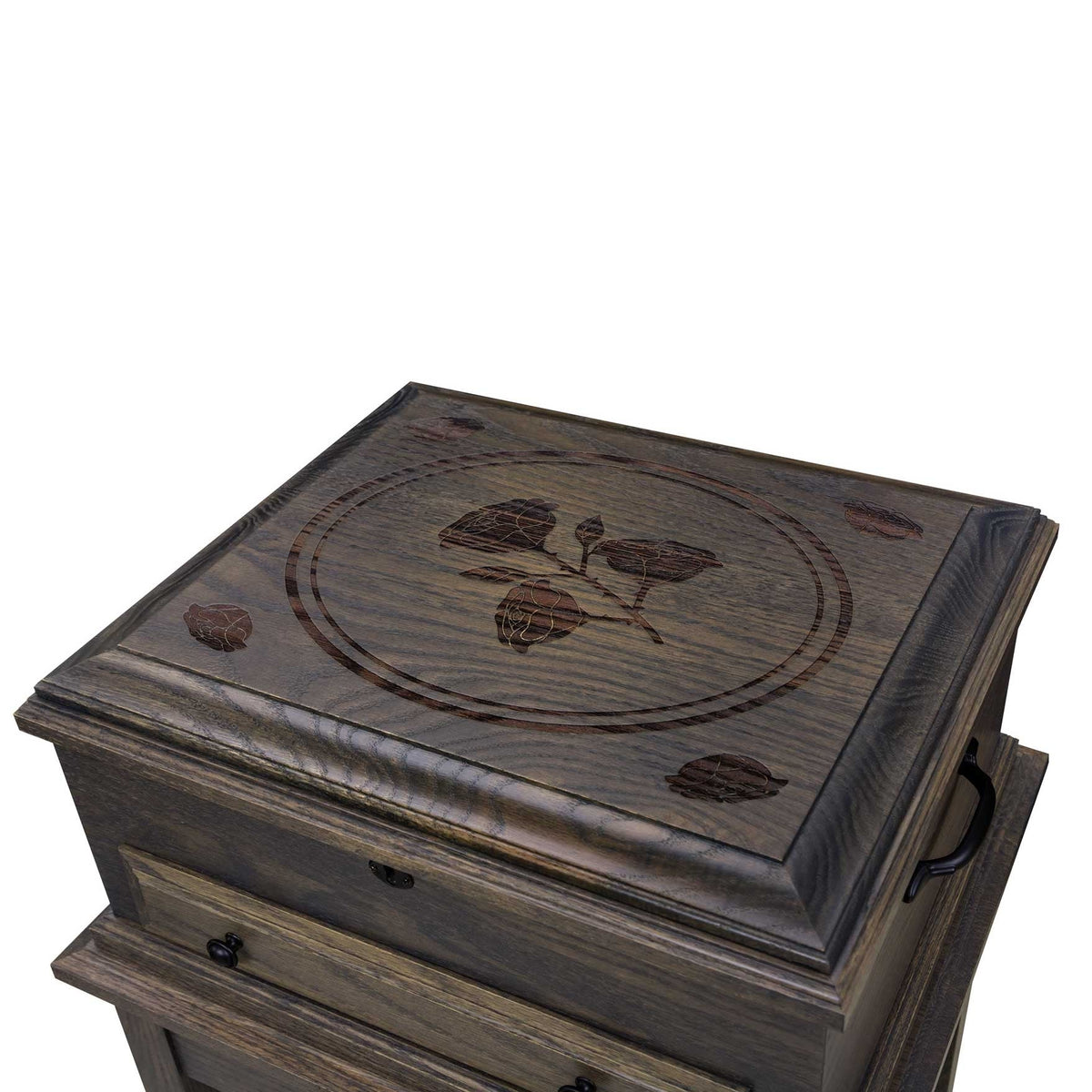 Close up of the jewelry chest lid with a carved rose and leaf medallion inlay in gray stained oak