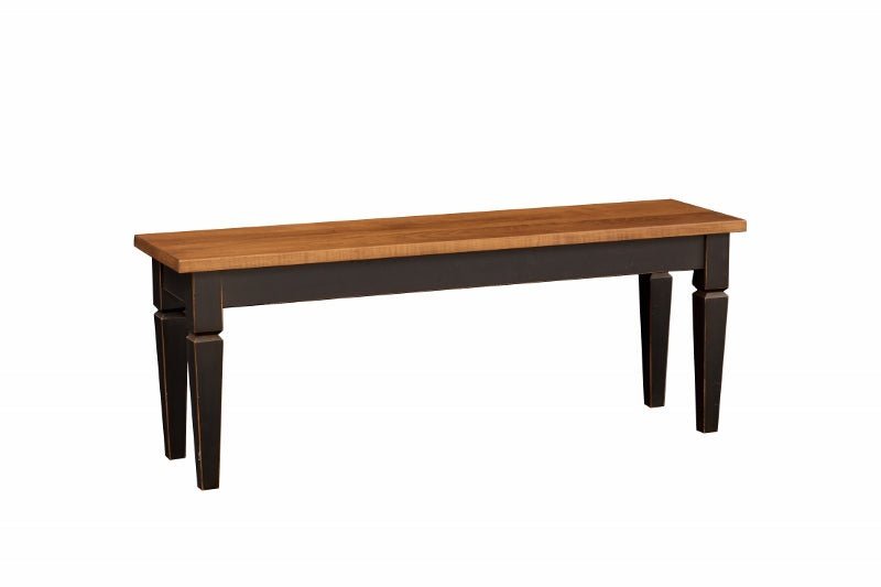 Angled view of a farmhouse dining bench pairing an oak stained seat with a distressed black painted base