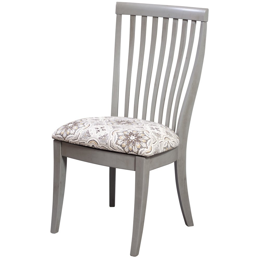 Gray painted slat back dining chair with a gray and tan floral patterned upholstered seat and flared legs
